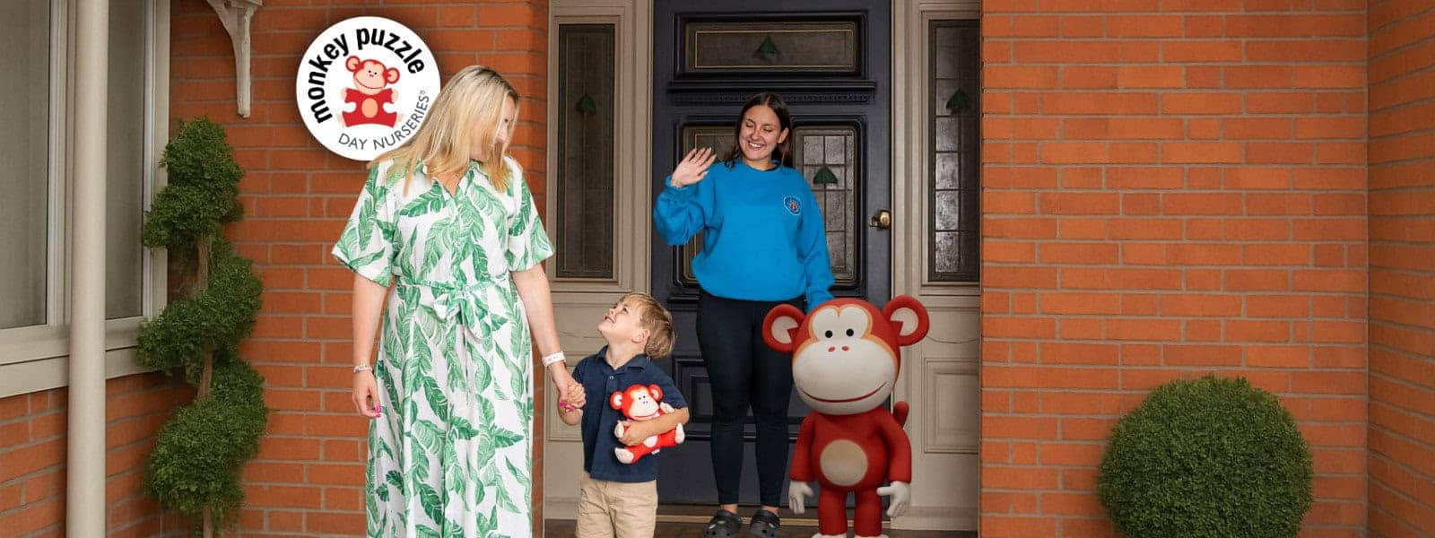 Friendly entrance of Monkey Puzzle Day Nurseries showcasing staff, children, and playful monkey mascots at the childcare center. Bright, welcoming environment focused on early childhood development and quality childcare.